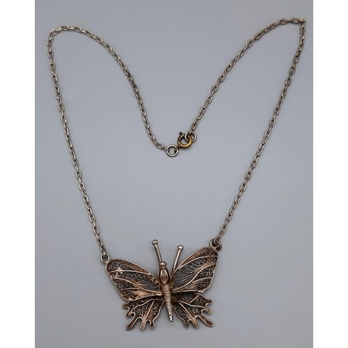 989 - A Beautifully Designed Vintage Filigree Silver Butterfly Drop Pendant. Comes on a silver link neckla... 