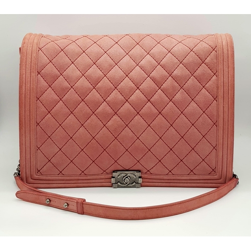 193 - A Chanel Maxi Boy Shoulder Bag. Pink quilted suede flap on leather. Heavy brushed steel finish on ha... 