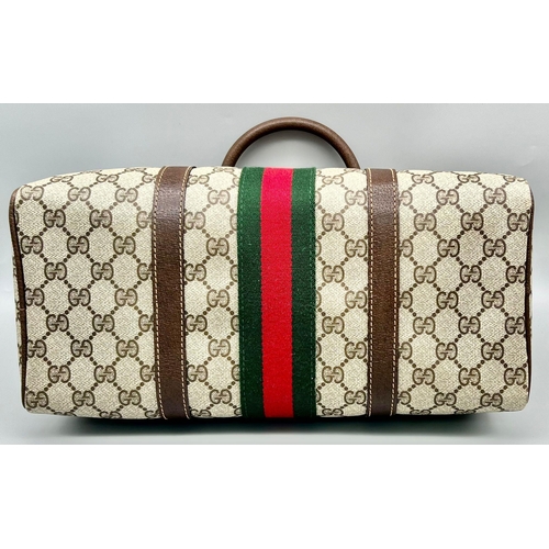 38 - A Gucci Doctor Satchel Bag. Monogram canvas and trimmed brown leather. Zipped interior compartment. ... 