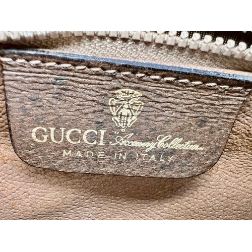 38 - A Gucci Doctor Satchel Bag. Monogram canvas and trimmed brown leather. Zipped interior compartment. ... 