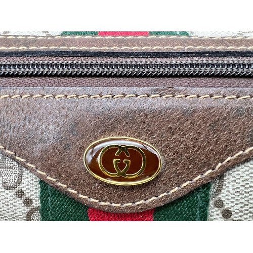 38 - A Gucci Doctor Satchel Bag. Monogram canvas and trimmed brown leather. Zipped interior compartment. ... 