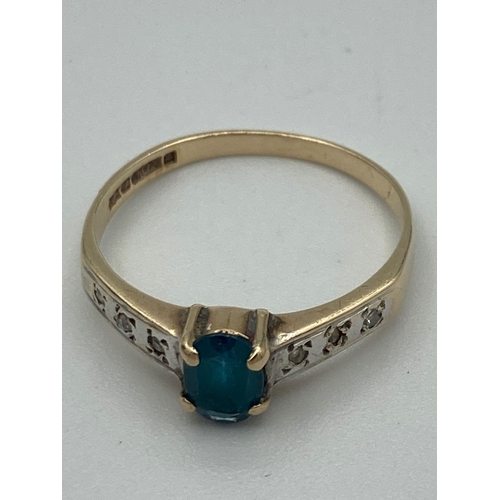 175 - 9 carat YELLOW GOLD RING with oval AQUA set to top,having WHITE GOLD shoulders with diamond detail. ... 