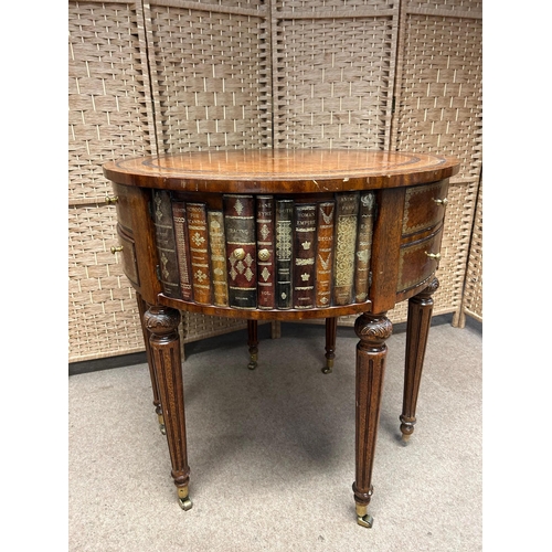 138 - Maitland Smith Round Leather-Wrapped Book Motif Design Side Table on Castors. There are three sets o... 