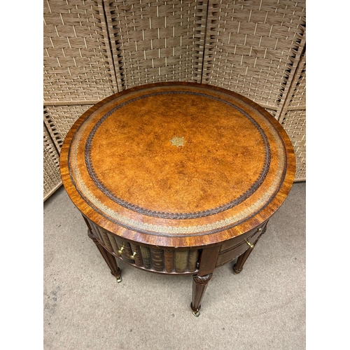 138 - Maitland Smith Round Leather-Wrapped Book Motif Design Side Table on Castors. There are three sets o... 