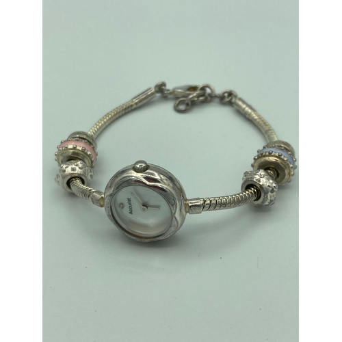 Ladies ACCURIST QUARTZ CHARMED BRACELET WATCH. Pandora style bracelet with charms having circular