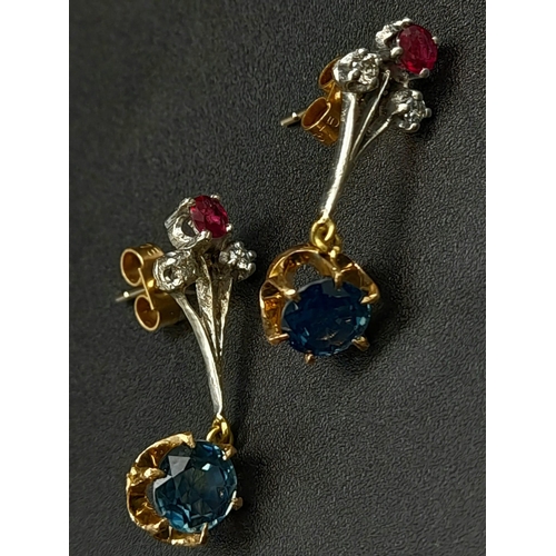 998 - A Pair of dangler earrings with 1ct each of natural sapphires, diamonds and rubies. Set in white met... 