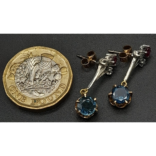 998 - A Pair of dangler earrings with 1ct each of natural sapphires, diamonds and rubies. Set in white met... 