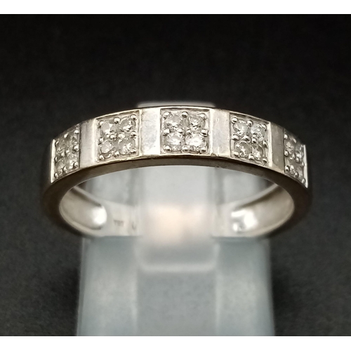 103 - An 18K Gold and Diamond Half-Eternity Ring. 0.20ct approx. Size O 1/2. 3.3g total weight. Ref: 11910