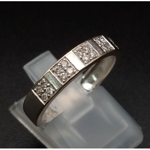 103 - An 18K Gold and Diamond Half-Eternity Ring. 0.20ct approx. Size O 1/2. 3.3g total weight. Ref: 11910