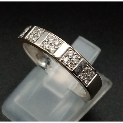 103 - An 18K Gold and Diamond Half-Eternity Ring. 0.20ct approx. Size O 1/2. 3.3g total weight. Ref: 11910