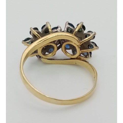 177 - A vintage, 18 K yellow gold ring with a double cluster with diamonds (0.30 carats) and sapphires. Ri... 