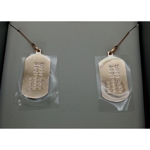 124 - A Pair of Christian Dior Gilded Tag Earrings. Comes with a silver tone pouch and box. Excellent cond... 