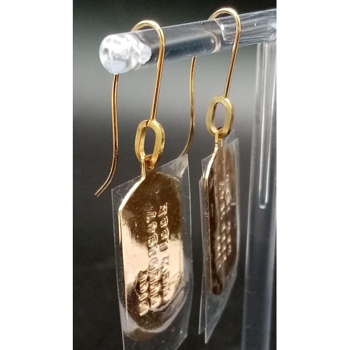 124 - A Pair of Christian Dior Gilded Tag Earrings. Comes with a silver tone pouch and box. Excellent cond... 