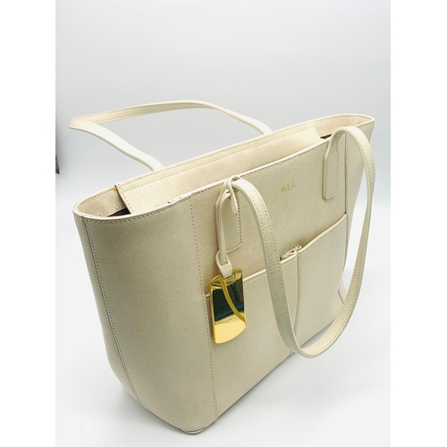 2 - A Ralph Lauren Cream Leather Handbag. Two exterior flaps. Zipped inner compartment. 36cm width. 26cm... 