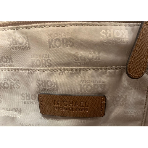 229 - A Michael Kors Brown Mid-Size Leather Shoulder Bag. Textured finish with gilded touches. Comes with ... 