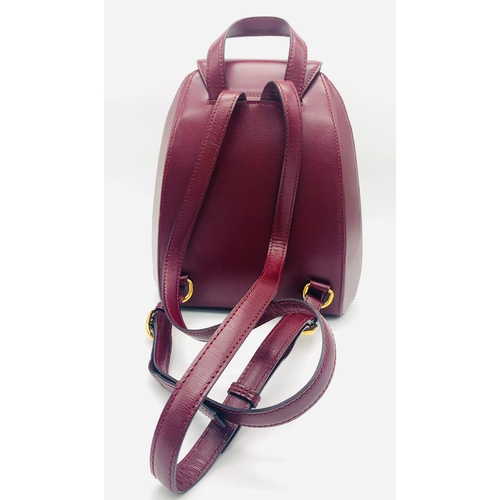 52 - A Lovely Must de Cartier Small Backpack. Burgundy leather with embossed logo to the front. Single to... 