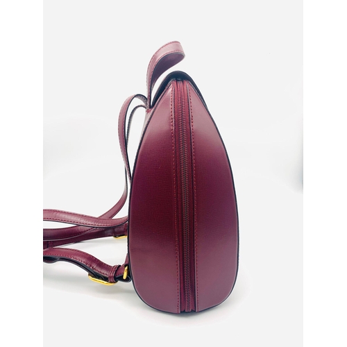 52 - A Lovely Must de Cartier Small Backpack. Burgundy leather with embossed logo to the front. Single to... 