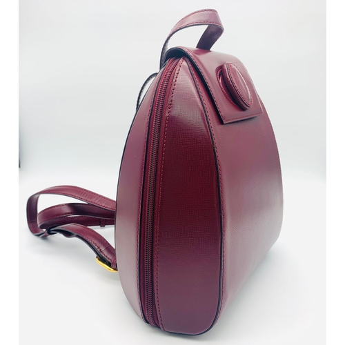 52 - A Lovely Must de Cartier Small Backpack. Burgundy leather with embossed logo to the front. Single to... 