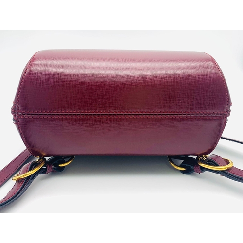 52 - A Lovely Must de Cartier Small Backpack. Burgundy leather with embossed logo to the front. Single to... 