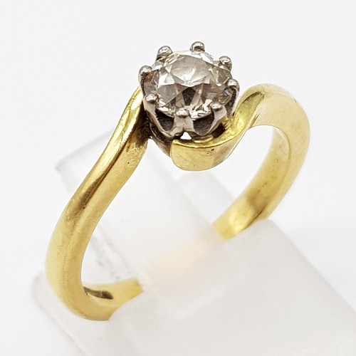 137 - An 18K Yellow Gold Diamond Solitaire Ring. Brilliant round cut diamond -0.5ct approx. Crossover styl... 