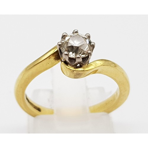 137 - An 18K Yellow Gold Diamond Solitaire Ring. Brilliant round cut diamond -0.5ct approx. Crossover styl... 