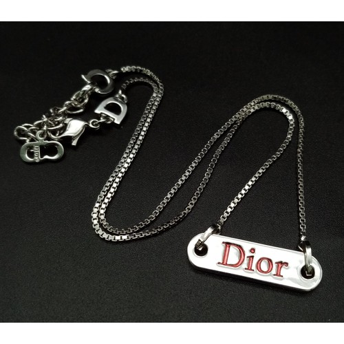 145 - A Christain Dior White Metal Tag Necklace and Bracelet. Both adjustable. Excellent condition. Comes ... 