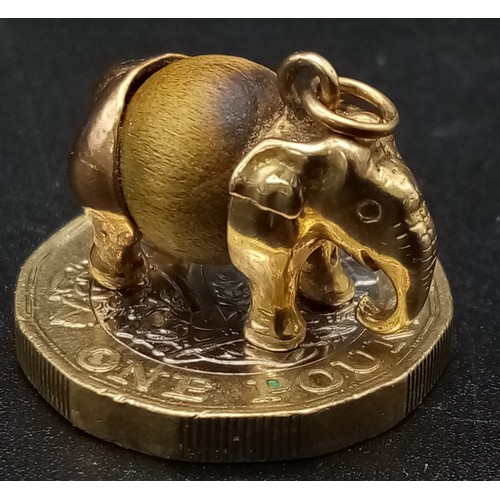 111 - A 9K Yellow Gold and Tigers Eye Elephant Pendant/Charm. 
5.47g total weight.