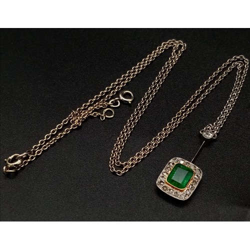 272 - An Emerald and Diamond Pendant on a Yellow Metal Chain. Rectangular emerald with a diamond surround ... 