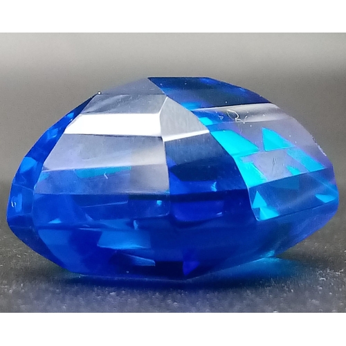 147 - A mouth-watering, huge (90.15 carats) TANZANITE. Emerald cut, lab created, flawless, in perfect cond... 