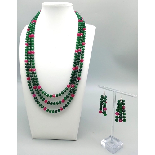 161 - A very feminine, three row necklace and earrings set with multifaceted emeralds and rubies. Necklace... 