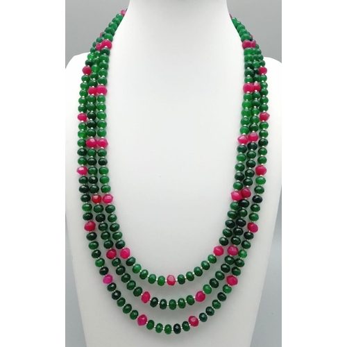 161 - A very feminine, three row necklace and earrings set with multifaceted emeralds and rubies. Necklace... 