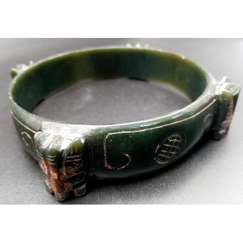 182 - An antique, Chinese, dark green jade, hand carved bracelet in Chinese, custom made, presentation box... 