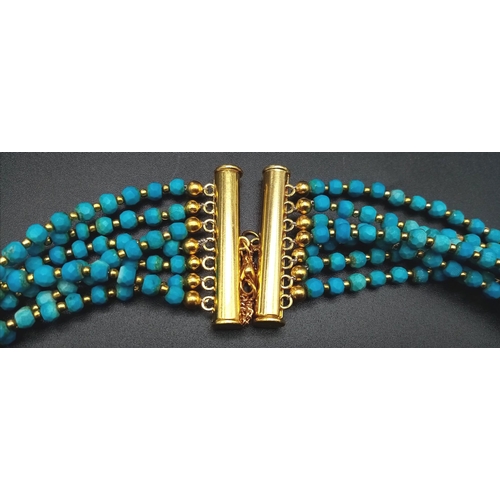 189 - A Turquoise coloured, seven row necklace in Ancient Egyptian Revival fashion. Length: 47-62 cm with ... 