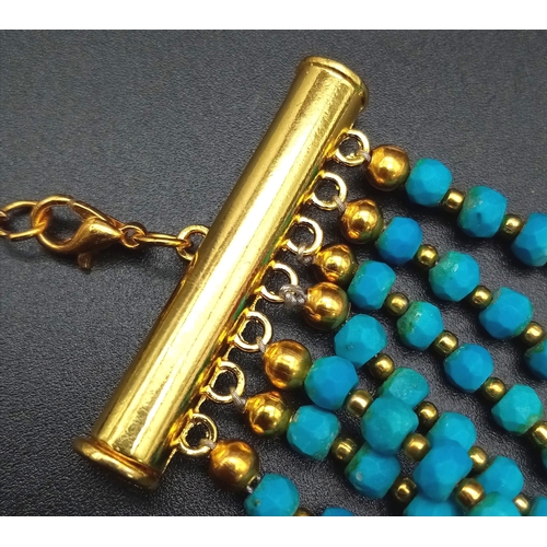 189 - A Turquoise coloured, seven row necklace in Ancient Egyptian Revival fashion. Length: 47-62 cm with ... 