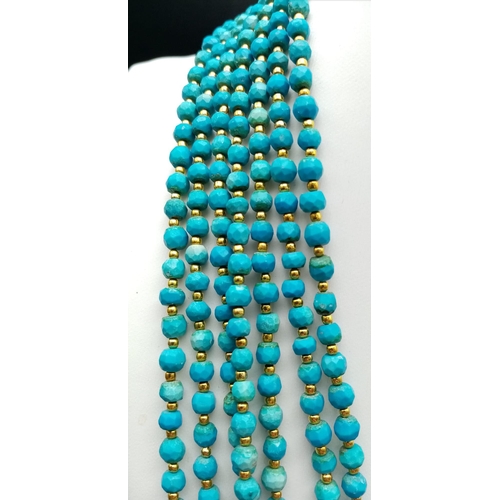 189 - A Turquoise coloured, seven row necklace in Ancient Egyptian Revival fashion. Length: 47-62 cm with ... 