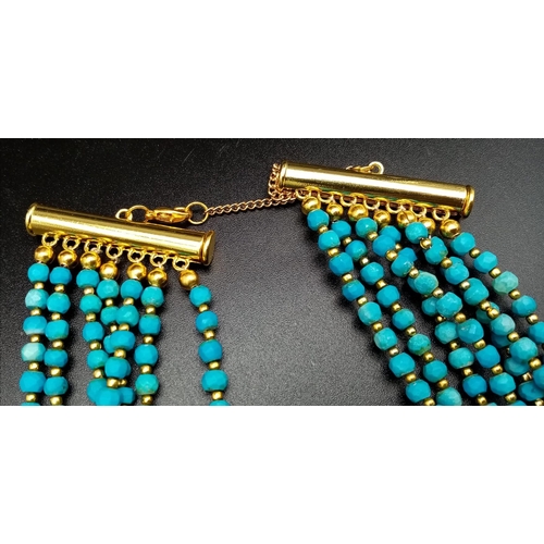 189 - A Turquoise coloured, seven row necklace in Ancient Egyptian Revival fashion. Length: 47-62 cm with ... 