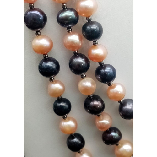 217 - A very desirable, three row, Tahitian black and pink pearls necklace and earrings set. Necklace leng... 