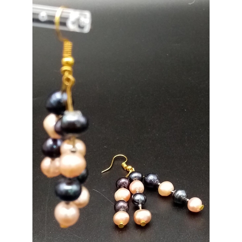 217 - A very desirable, three row, Tahitian black and pink pearls necklace and earrings set. Necklace leng... 