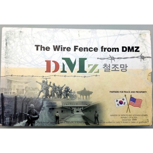 511 - Boxed and framed barb wir6e section from DMZ between North and South Korea.
This is the gift which o... 