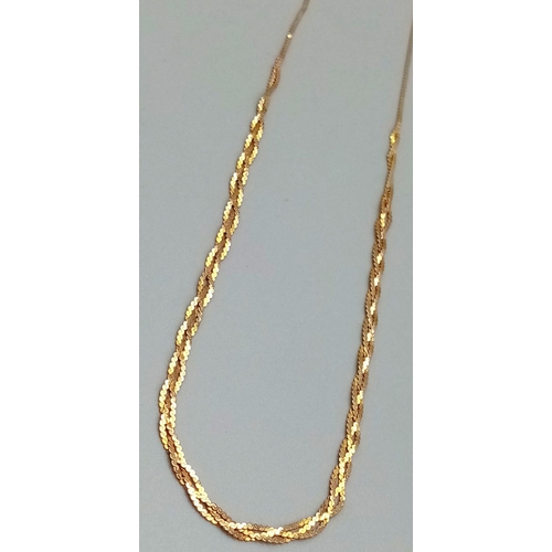 546 - A Delicate 9K Yellow Gold Necklace with Lattice Effect. 38cm.
1.82g