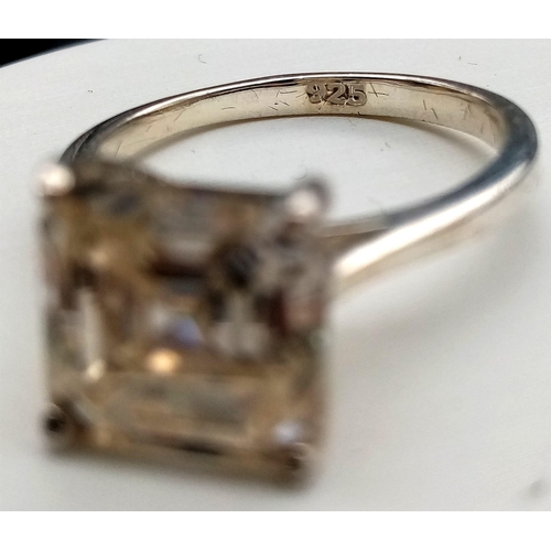 631 - A 3.85ct Princess Cut White Moissanite Ring. Set in 925 Silver. Size N 1/2. Comes in a presentation ... 