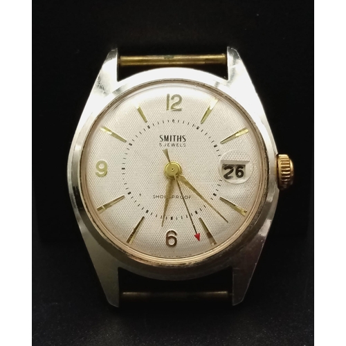 1187 - A Vintage Smiths 5 Jewels Watch Case - 34mm. White dial with date window. Mechanical movement in wor... 