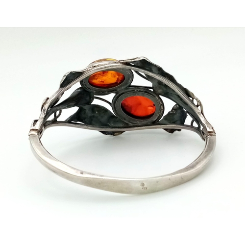 133 - A gorgeous, real ART NOUVEAU, sterling silver bangle with a naturalistic design and two large Baltic... 