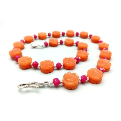 210 - A highly unusual carnelian and ruby necklace and earrings set. Hand carved, rose shaped, carnelian b... 