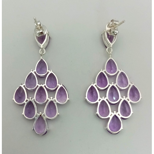 496 - A Pair of Teardrop Amethyst Gemstone Dangler Earrings set in 925 Silver. 5cm dangle.