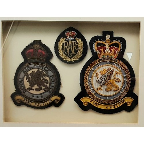 742 - A Framed and Glazed Set of Three Vintage Royal Airforce Cloth Badges. 28x23cm.