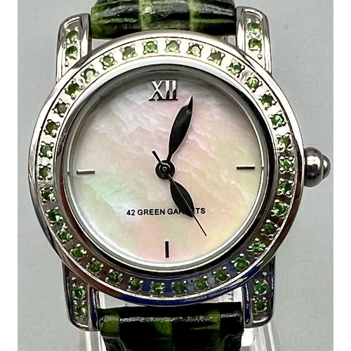 1121 - A Ladies Gem Set Quartz Stainless Steel Watch Set with 42 Green Garnets in the Bezel and Shoulders, ... 