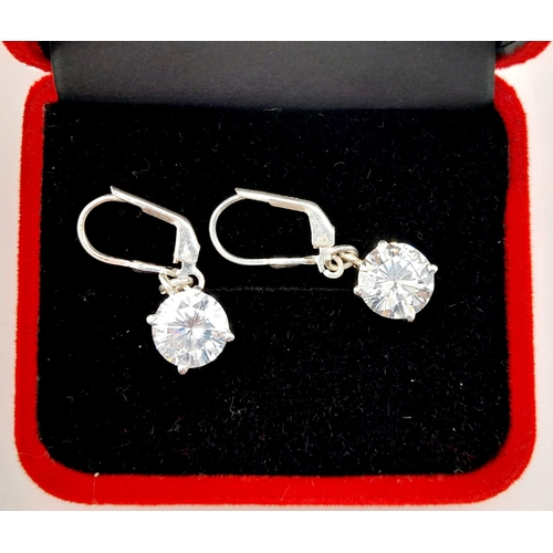 15 - A Pair of White Diamond (laboratory) Drop Earrings Set in 925 Silver. 4ct diamond total approx. 9mm ... 