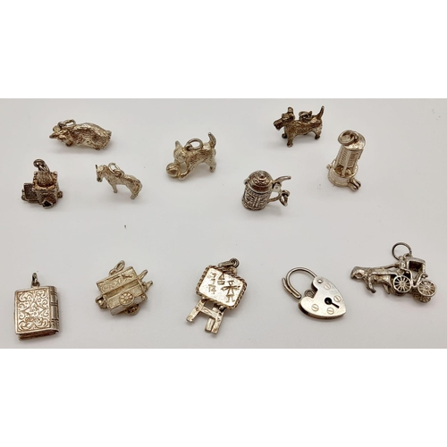 526 - Twelve 925 Silver Charms/Pendants. Please see photos for finer details. 45.4g total weight.