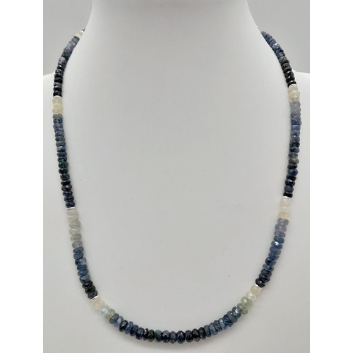 564 - A 120ct (total) Blue Ceylon Sapphire Necklace - 40cm, silver clasp, with a pair of sapphire drop ear... 